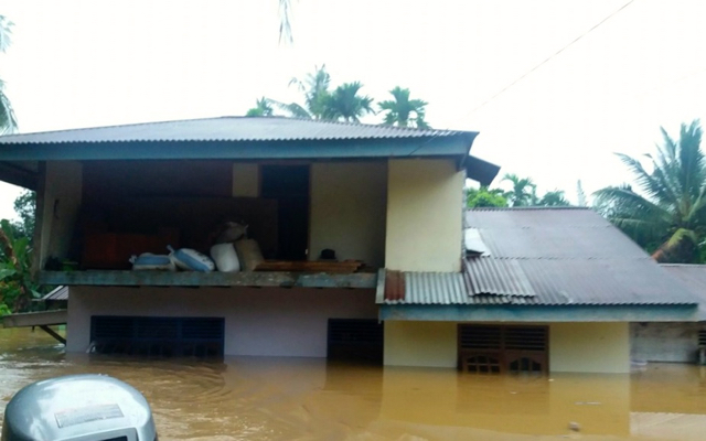 Banjir di Rokan Hulu, Riau, yang menyebabkan lebih 1.000 rumah terendam banjir. Foto: BNPB